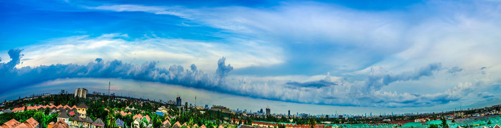 Panoramic view of trees against blue sky