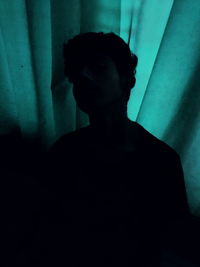 Portrait of young man looking at home