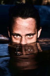 Portrait of young man in swimming pool