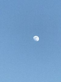 Low angle view of moon in sky