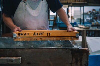 Man working on wood