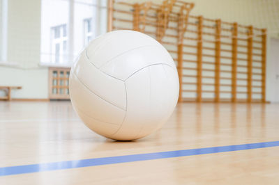 Close-up of on volleyball on court