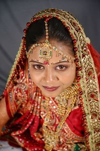 Portrait of beautiful young bride at home