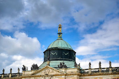 Low angle view of statue of building against sky