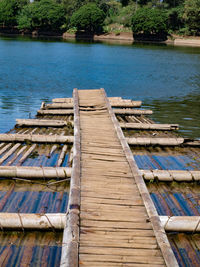 High angle view of pier over lake in forest