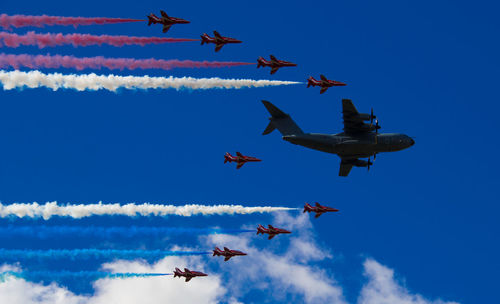 Low angle view of airshow in sky