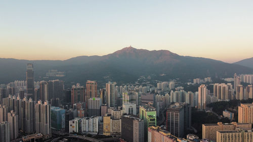 Aerial view of cityscape against sky during sunset