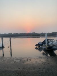 Scenic view of lake against sky during sunset