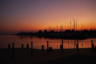 Silhouette of harbor at sunset