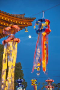 Low angle view of statue against blue sky