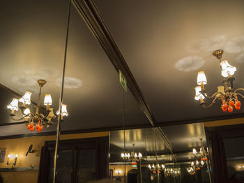 Low angle view of illuminated street light at night