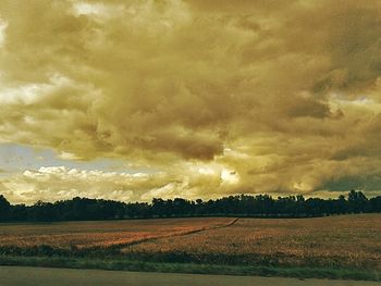 Scenic view of landscape against cloudy sky