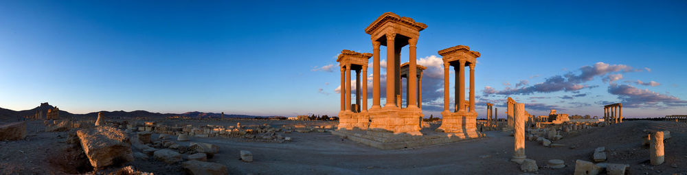 Panoramic view of ruins of temple against blue sky