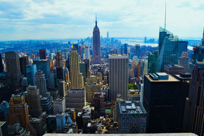 City skyline against cloudy sky