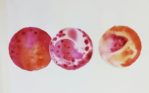 Close-up of strawberry over white background