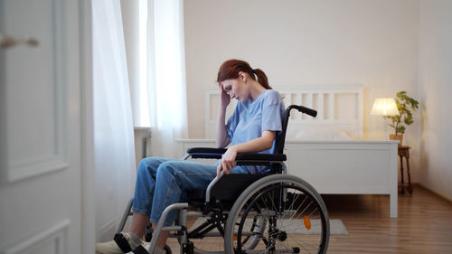 Woman sitting in room at home