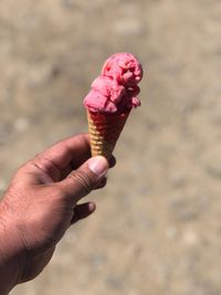 Close-up of hand holding ice cream