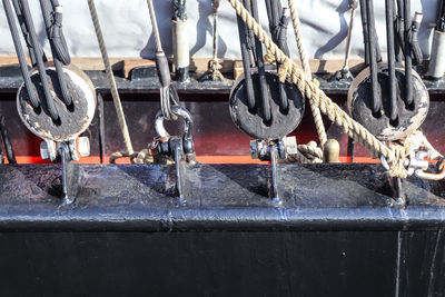 Detailed close up detail of ropes and cordage in the rigging of an old wooden vintage sailboat.