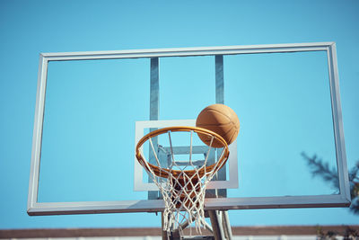 Low angle view of basketball hoop against sky