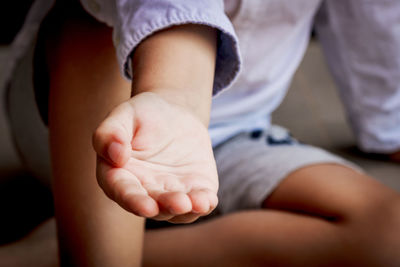 Close-up of kid asking for assistance.