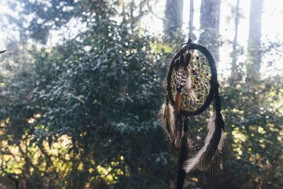 Close-up of dreamcatcher against sky