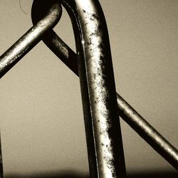 Close-up of metal against sky