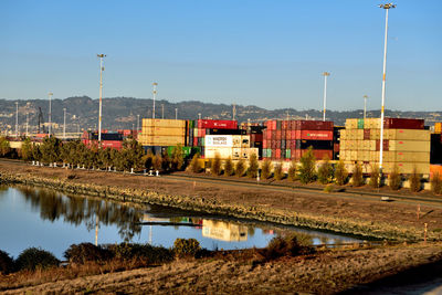 Train at railroad station against sky