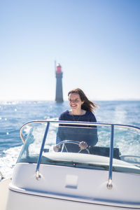 Woman on boat in sea