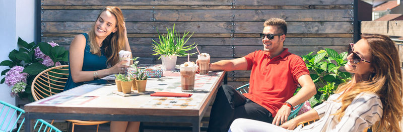 Man enjoying with friends on rooftop