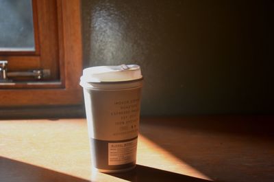 Close-up of coffee cup on table