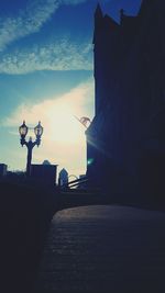 Silhouette of man on road against sky