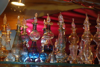 Close-up of illuminated glasses on table