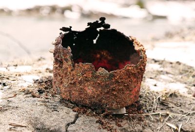 Close-up of rusty metal on rock