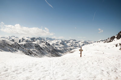 Scenic view of snow covered mountains against sky