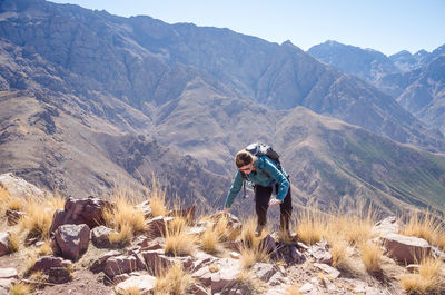 Full length of man standing on mountain