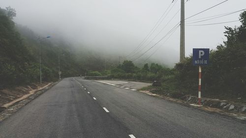 Road passing through foggy weather