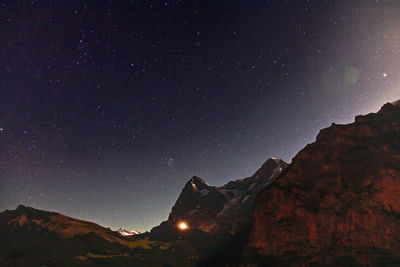 Low angle view of mountain against sky at night