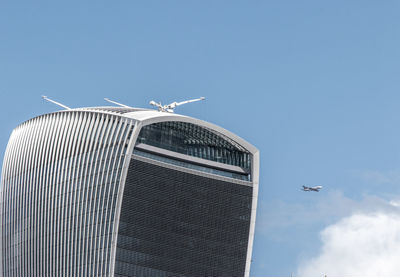 Low angle view of airplane flying in sky