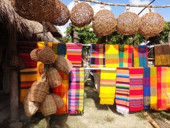 Multi colored hanging for sale at market stall