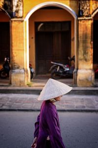 Woman with umbrella in city