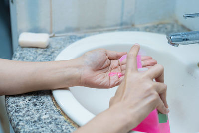 Close-up of woman holding hands