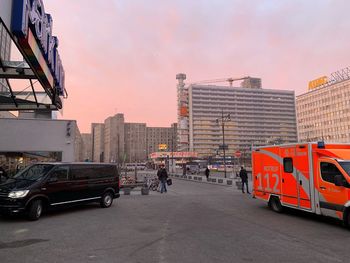 View of city street and buildings against sky