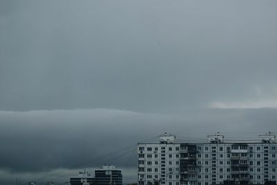 Buildings in city against sky