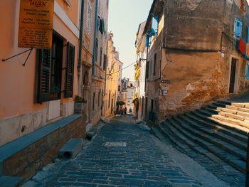 Alley amidst buildings in city