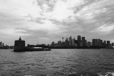 Cityscape against cloudy sky
