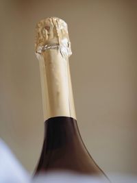 Close-up of wine bottle against white background