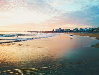 View of beach against sky during sunset