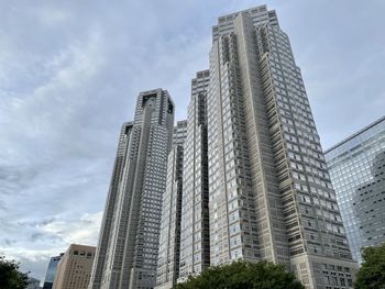 Low angle view of modern buildings against sky