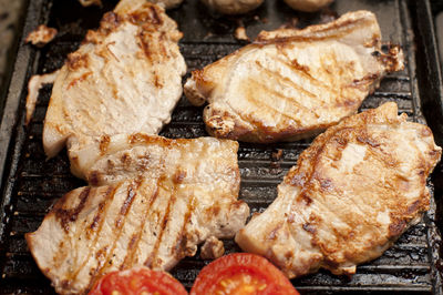 Close-up of meat on barbecue grill