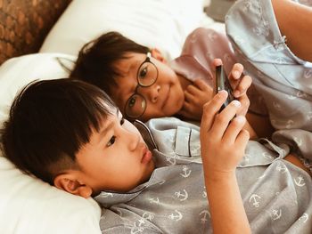 Cute baby boy lying on bed